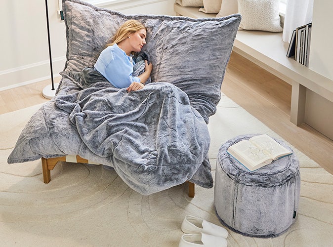 Woman napping on PillowSac Accent chair comfort guaranteed with 60-day trial